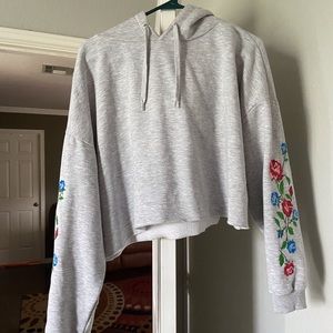 NWOT crop hoodie w/ flowers on sleeve